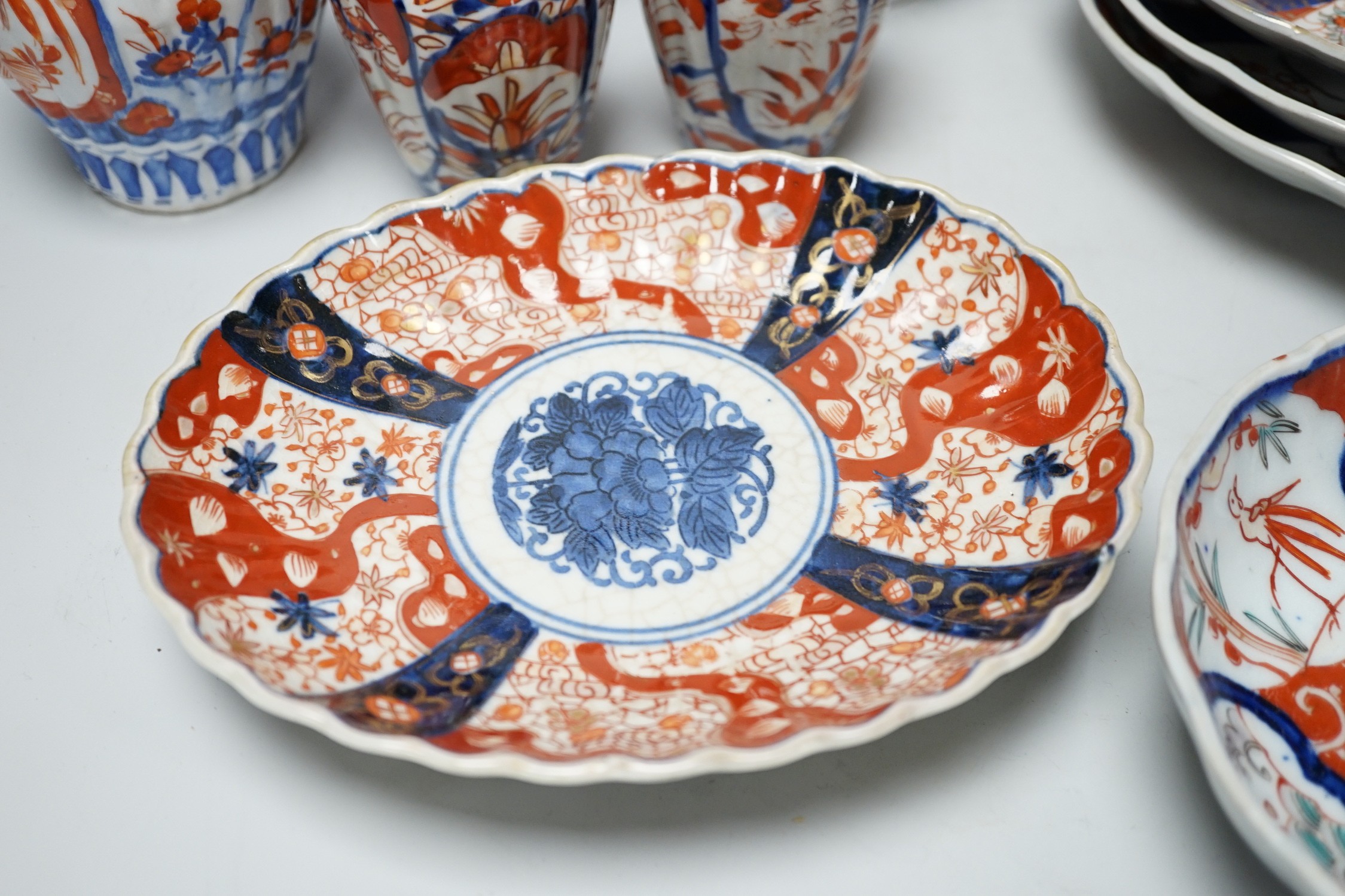 A group of Imari vases and dishes, tallest 19cm
